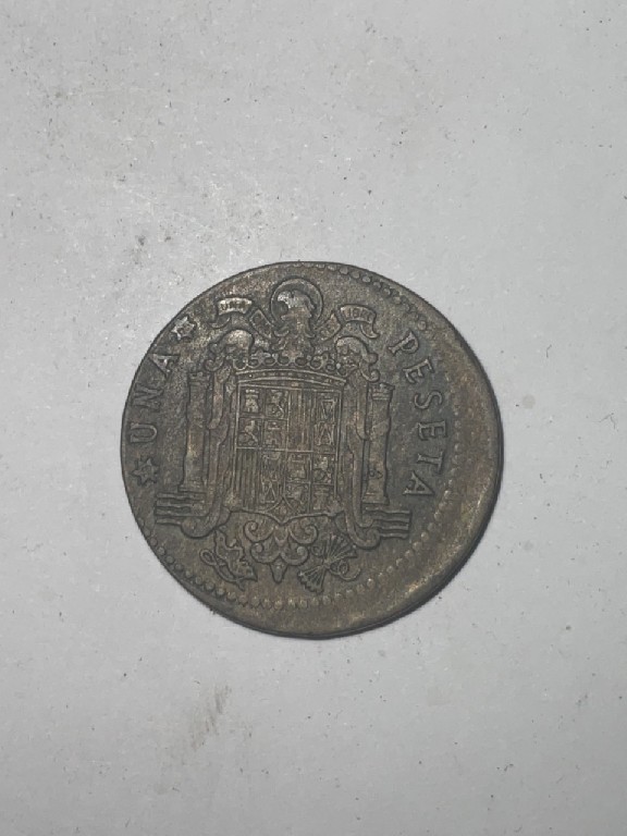 Foto 2 Moeda não identificada: 1 peseta 1963 error ?